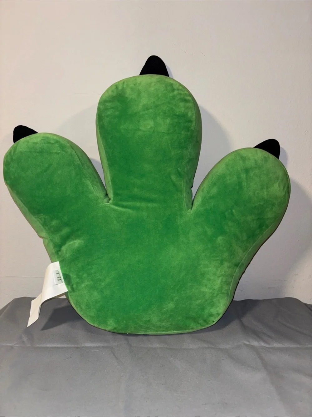 Hobby lobby green dinosaur foot throw pillow